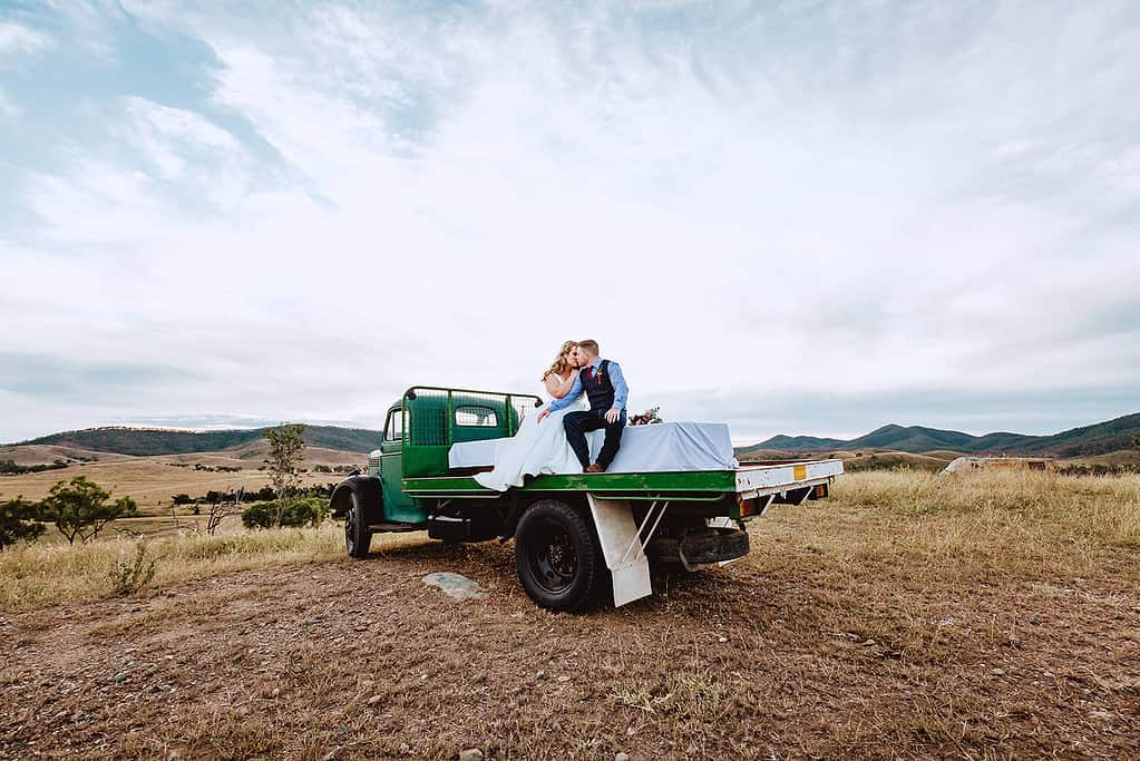 Wedding couple on an old truck